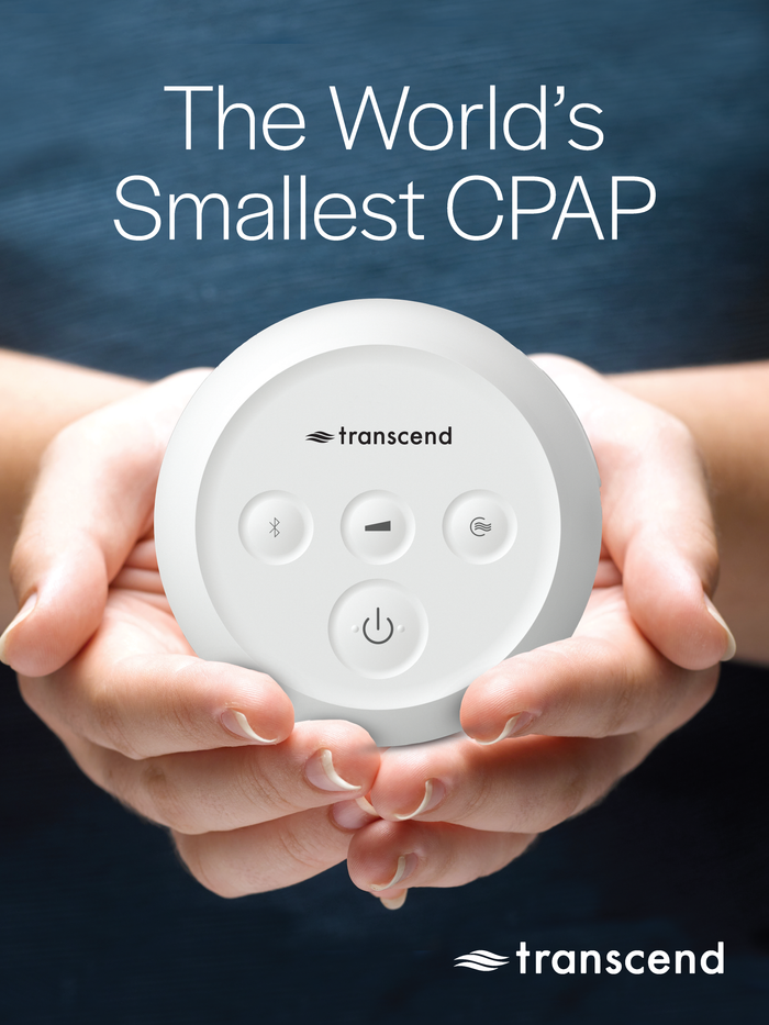 Transcend Micro CPAP device held in both hands with a dark background.